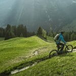 person-on-riese-muller-superdelite-mountain-ebike-in-mountains
