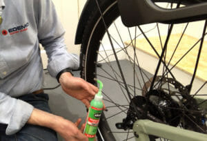 applying-slime-to-tyre-of-riese-muller-ebike - EDEMO