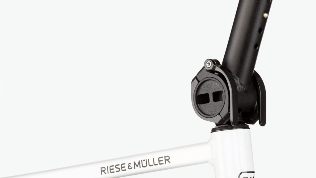 Riese and Muller Tinker2 review Stem adjustment feature on crystal white bike