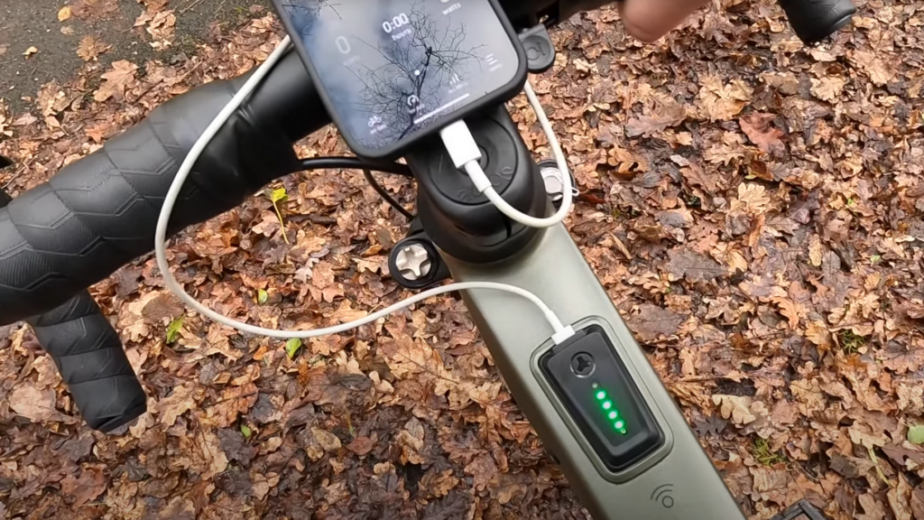 Riese & Müller UBN Five Commute Review: The E-Bike for Your Commute and Weekend Escapes! 5 Riese and Muller UBN Five Commute - showing a phone on the SP Connect mount and charging